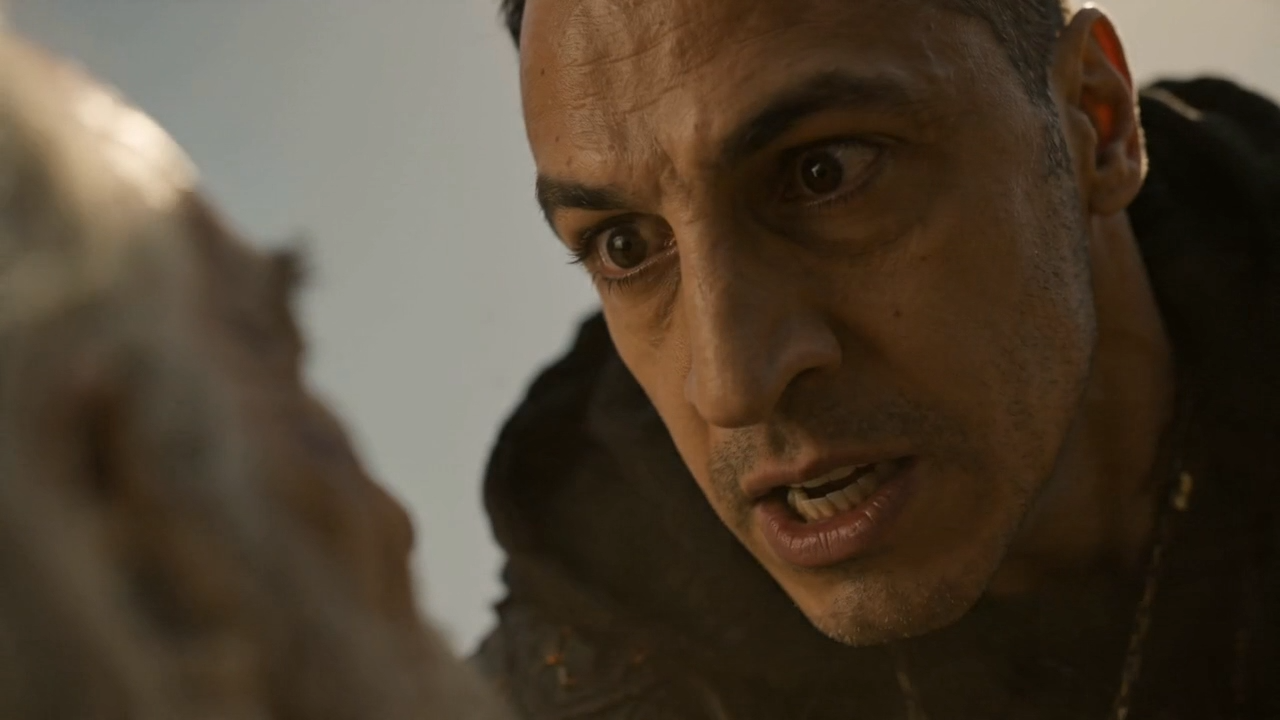 Close-up of a menacing hunter's face